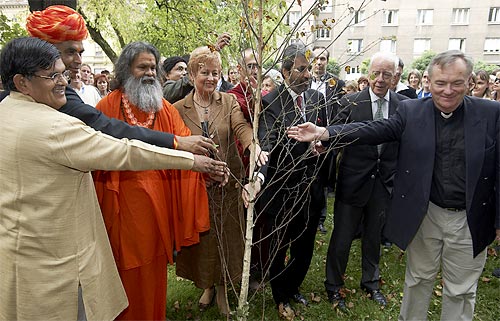 Planting a peace tree near the Summit venue